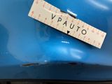 a sticker on the back of a blue car