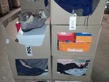 a cart with a lot of clothes on it