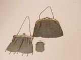 two purses that are sitting on a table