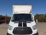 a white van that is parked in a parking lot