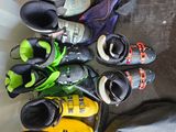 many pairs of shoes that are lined up on the floor
