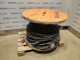 a wooden table with a spool on top of it
