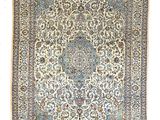 un ancien tapis persan à motif de médaillon