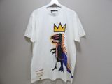 a white t - shirt with an image of a dinosaur wearing a crown on it