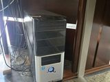 a small computer on the floor in the corner of a room