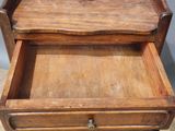 a wooden drawer with a drawer on top of it