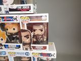 a lot of pop vinyl figures on display in the store