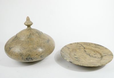 two bowls and a bowl on a white surface