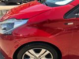 a red car parked on the side of the street