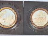pair of antique oval picture frames with gold rims on a white background