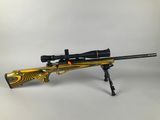 a rifle on a white background with a yellow and black background