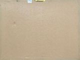 a picture of a cardboard box with a piece of yellow tape on it