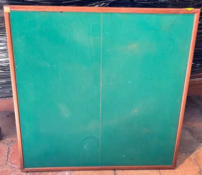 a green cabinet with two doors and a brown handle