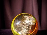 a glass ball that is sitting on a table