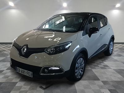 a picture of a car that is parked in a showroom