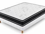 a close up of a mattress on top of a wooden base