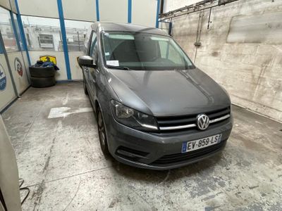 a grey vw van parked in a garage