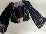an image of a black jacket with silver beads on it