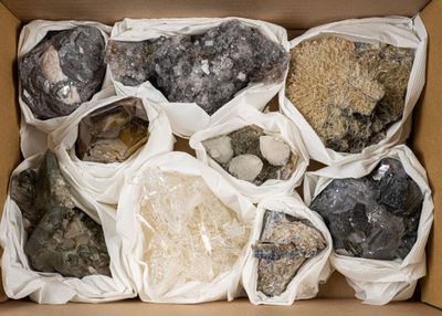 a box full of rocks and gravels in it