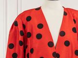 a red and black polka dot dress on a mannequin mannequin mannequin mannequin mannequin mannequin mannequin manne