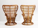 pair of vintage rattan lounge chairs in the style of the early 20th century