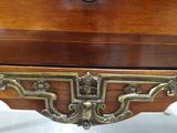 a small wooden table with a keyhole on top of it