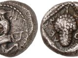 a silver coin with an image of a lion on it
