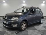 a picture of a grey dacia parked in a garage
