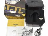 a box with a watch and a watch in it