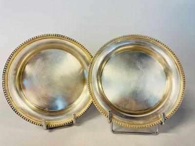 pair of silver plate with beaded edge on stand