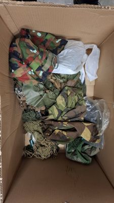 a cardboard box filled with assorted items in it