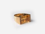 an image of a gold ring with diamonds on a white background