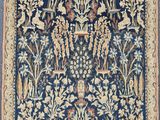 a blue rug with a floral design on it