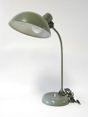 an image of a green desk lamp on a white background