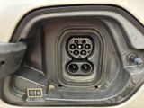 a close up of a car ' s fuel tank with a car plugged into it