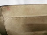 the inside of a tan purse with a zipper on it