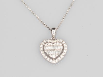 a diamond heart shaped pendant on a chain