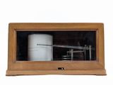 a picture of a wooden box with a machine inside of it