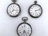 three antique pocket watches with roman numerals and roman numerals