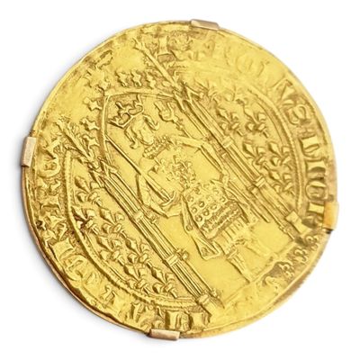l'image d'une pièce d'or sur laquelle figure l'image d'un homme