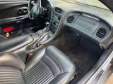 the interior of a car with black leather seats and a steering wheel