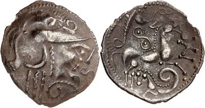 a silver coin with an image of a bull on it