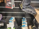 many pairs of shoes that are on display in a store