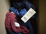 a box full of clothes with a price tag on it