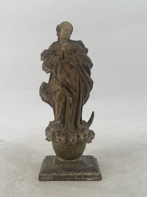 statue of a woman holding a bird on a pedestal