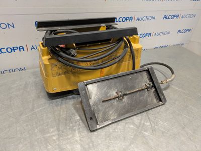 a close up of a machine with a hose attached to it