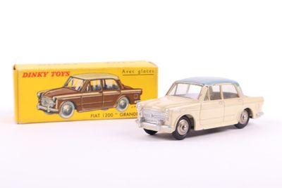 a toy car that is sitting next to a box