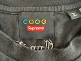 a close up of a black shirt with a colorful logo on it