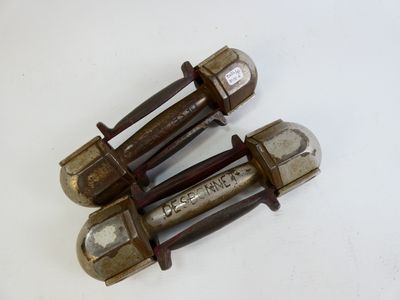 three old metal screws on a white surface