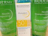 two bottles of bioderma sham and a bottle of sham on a table